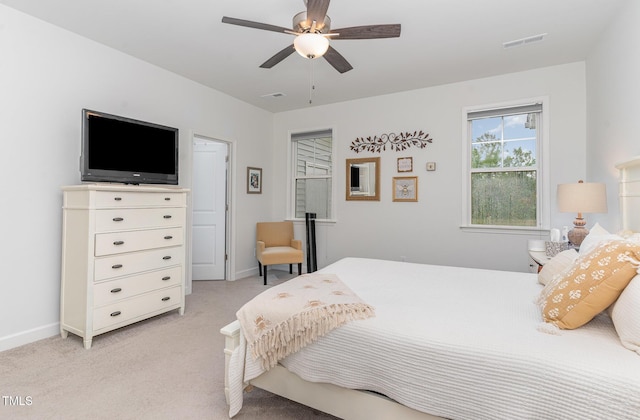 646 Shelford Trl, Zebulon, NC 27597 - bedroom with light carpet, baseboards, and a ceiling fan