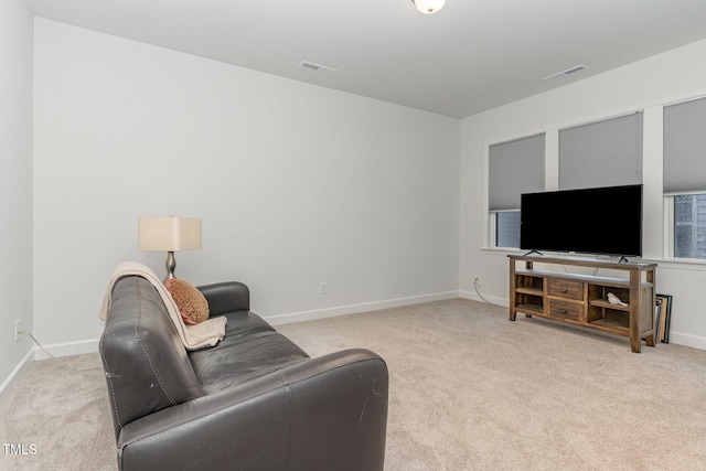 646 Shelford Trl, Zebulon, NC 27597 - living area featuring light carpet and baseboards