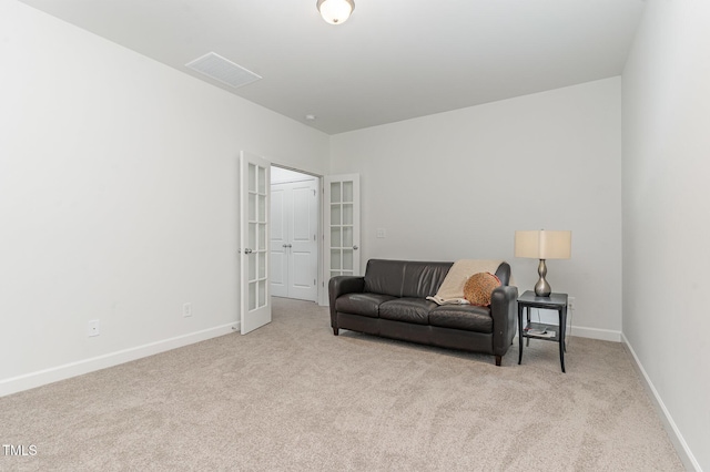 646 Shelford Trl, Zebulon, NC 27597 - carpeted living area with baseboards and french doors