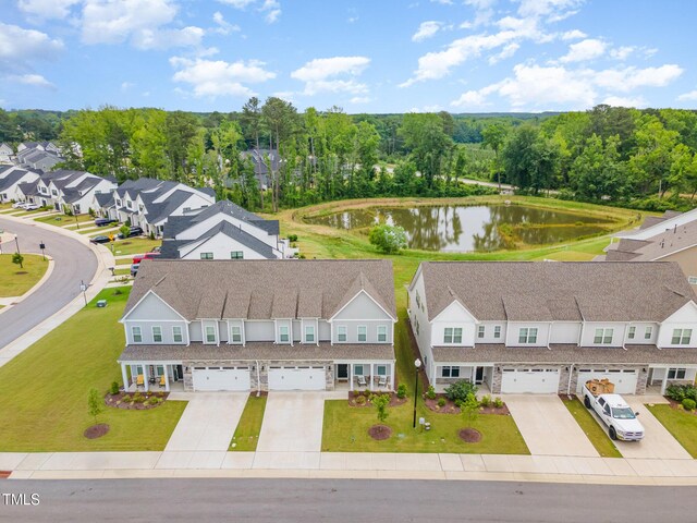 646 Shelford Trl, Zebulon, NC 27597 - aerial perspective of suburban area with a large body of water