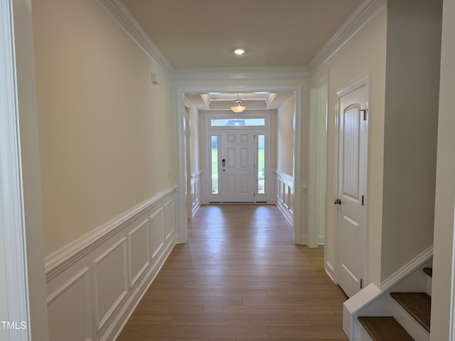 38 Gander Dr, Benson, NC 27504 - foyer featuring a decorative wall, ornamental molding, wood finished floors, a wainscoted wall, and stairway