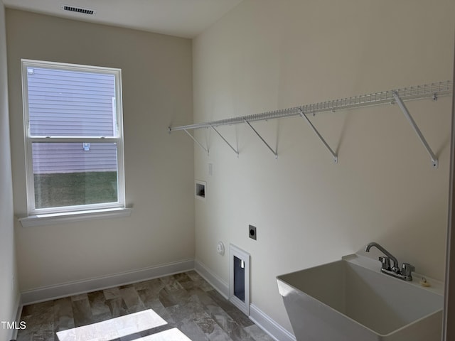 38 Gander Dr, Benson, NC 27504 - laundry room with electric dryer hookup, baseboards, and hookup for a washing machine