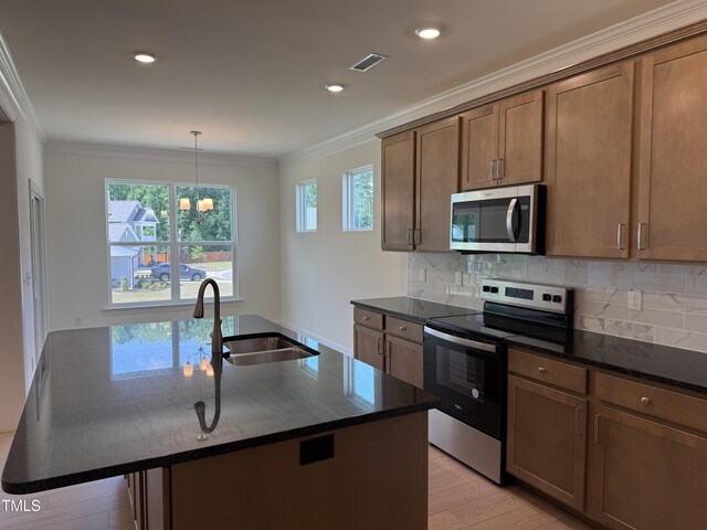 38 Gander Dr, Benson, NC 27504 - kitchen with stainless steel appliances, a sink, ornamental molding, dark stone countertops, and backsplash