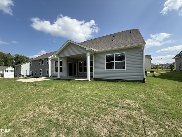 38 Gander Dr, Benson, NC 27504 - rear view of house with a patio, a lawn, and a shingled roof