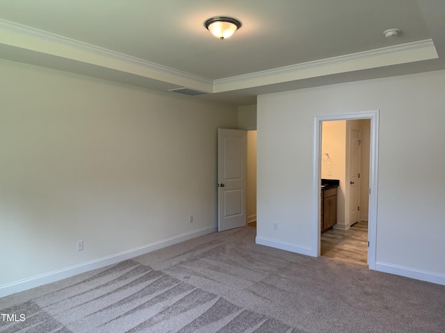 38 Gander Dr, Benson, NC 27504 - unfurnished bedroom featuring a tray ceiling, carpet floors, ornamental molding, and baseboards