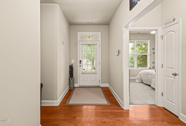 entrance foyer with wood finished floors and baseboards
