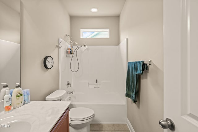 full bath featuring tile patterned flooring, toilet, vanity, tub / shower combination, and baseboards
