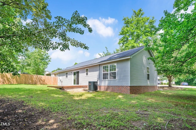 rear view of property featuring central air condition unit