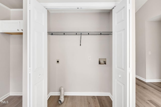 washroom featuring hookup for an electric dryer, hookup for a washing machine, light wood-style floors, and baseboards