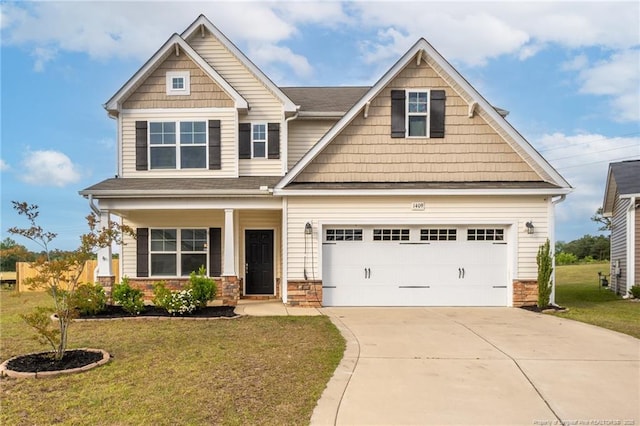 1409 Amen Ct, Hope Mills, NC 28348 - craftsman inspired home with concrete driveway, a front lawn, stone siding, and a porch