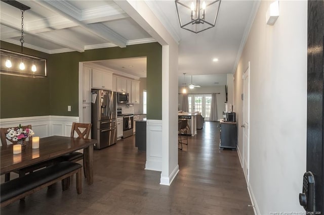 1409 Amen Ct, Hope Mills, NC 28348 - dining room with ornamental molding, dark wood finished floors, beam ceiling, a chandelier, and a wainscoted wall
