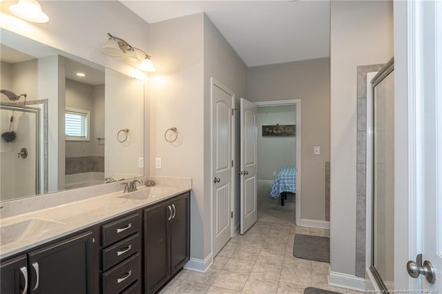 1409 Amen Ct, Hope Mills, NC 28348 - bathroom featuring a stall shower, tile patterned flooring, double vanity, and baseboards