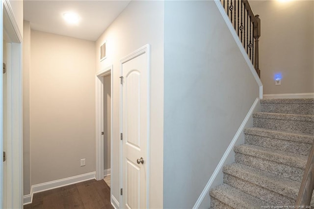 1409 Amen Ct, Hope Mills, NC 28348 - stairs featuring wood finished floors and baseboards