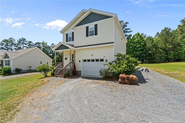 view of front facade featuring gravel driveway, an attached garage, and a front yard
