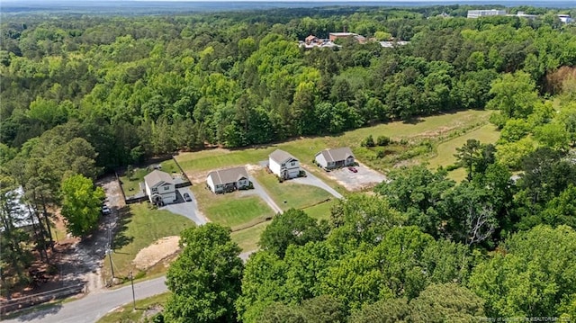 aerial overview of property's location featuring a forest