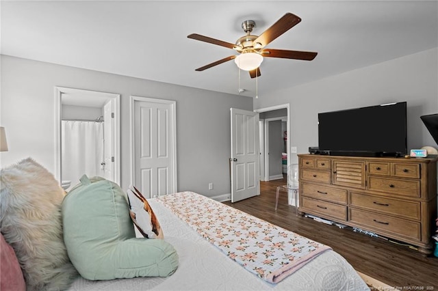 bedroom featuring wood finished floors, baseboards, and ceiling fan