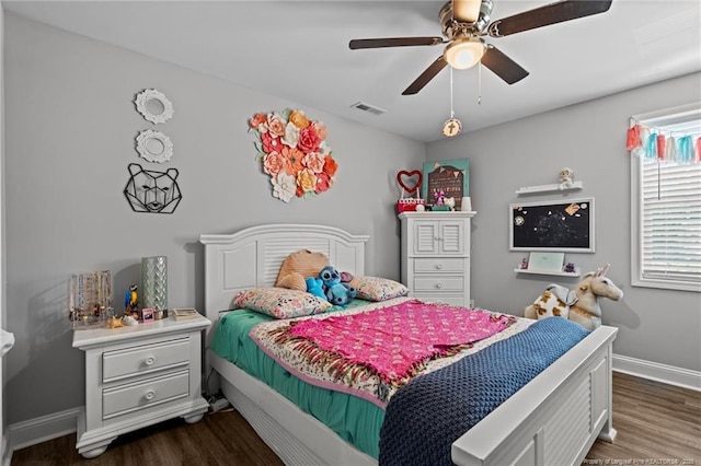 bedroom featuring dark wood-type flooring, baseboards, and a ceiling fan
