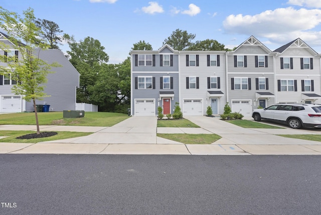 multi unit property with concrete driveway, a front lawn, and a garage
