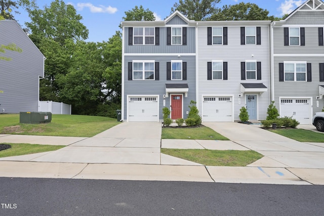 view of front of home featuring concrete driveway and a garage