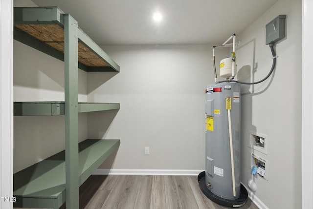 utility room featuring water heater