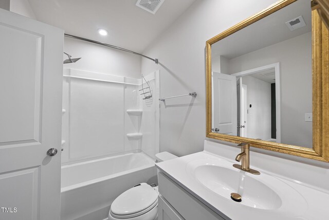 bathroom featuring vanity, washtub / shower combination, toilet, and recessed lighting