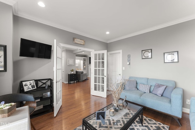 living room with french doors, crown molding, recessed lighting, wood finished floors, and baseboards