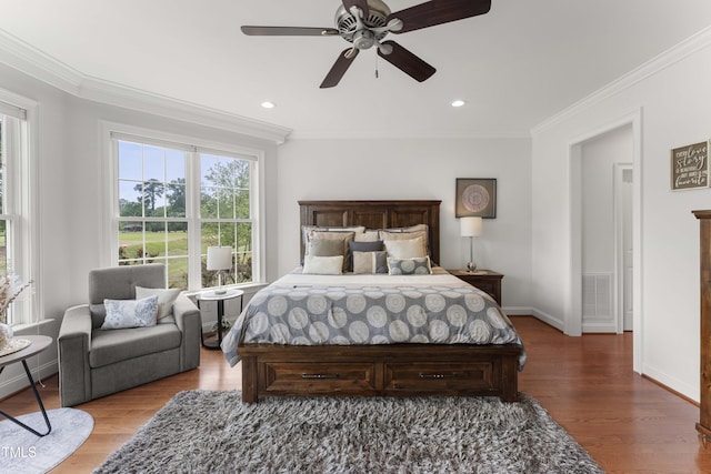 bedroom with ornamental molding, baseboards, wood finished floors, recessed lighting, and a ceiling fan