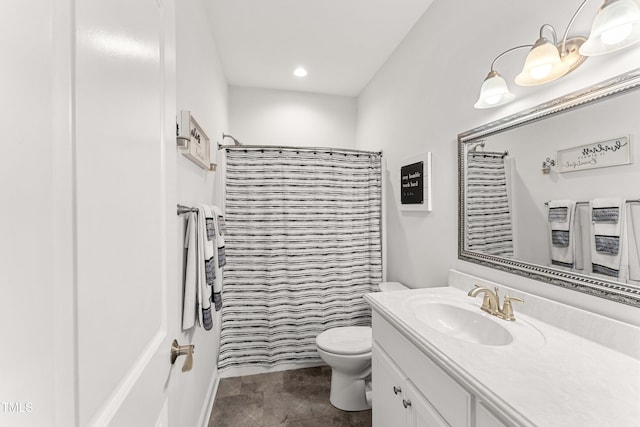 bathroom with vanity, toilet, a shower with shower curtain, and recessed lighting