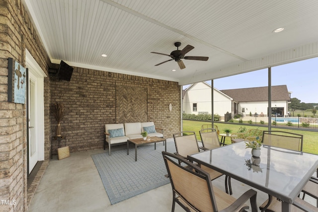 view of patio featuring ceiling fan, outdoor lounge area, and outdoor dining area