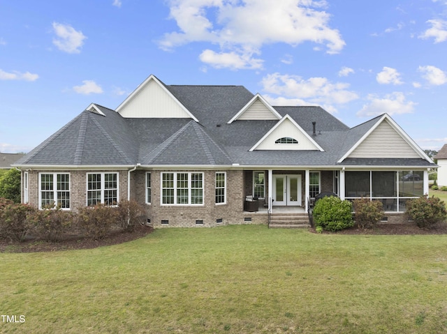 view of front of property featuring french doors, crawl space, a front lawn, and brick siding