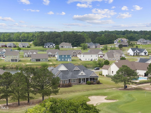 aerial perspective of suburban area featuring a golf course
