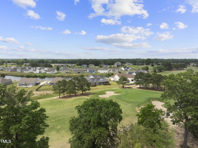 aerial view of residential area with a local golf course