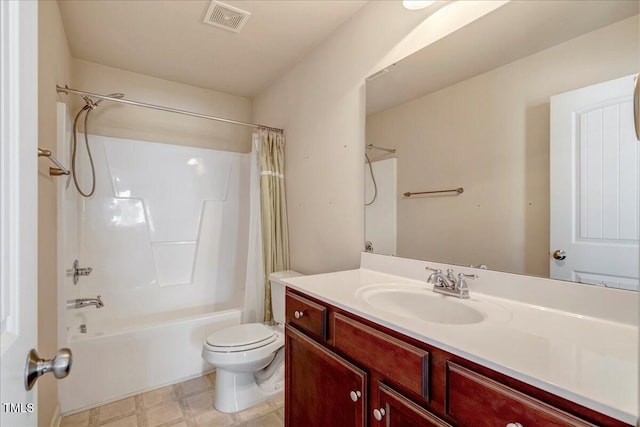 bathroom featuring toilet, shower / bath combo, vanity, and tile patterned floors