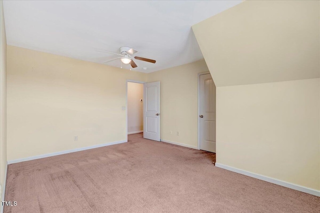 bonus room with a ceiling fan, carpet, and baseboards