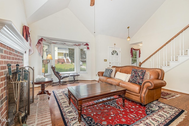 1720 Kingston Heath Way, Raleigh, NC 27604 - living area with wood finished floors, high vaulted ceiling, stairs, and baseboards