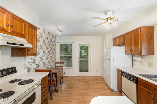 1720 Kingston Heath Way, Raleigh, NC 27604 - kitchen featuring white appliances, under cabinet range hood, light wood-style floors, a ceiling fan, and light countertops