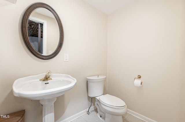 1720 Kingston Heath Way, Raleigh, NC 27604 - bathroom featuring baseboards, toilet, and tile patterned floors