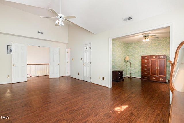 1720 Kingston Heath Way, Raleigh, NC 27604 - unfurnished living room with ceiling fan, wallpapered walls, baseboards, wood finished floors, and high vaulted ceiling