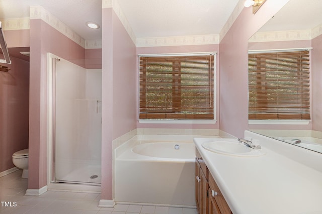 1720 Kingston Heath Way, Raleigh, NC 27604 - full bathroom featuring vanity, a shower stall, tile patterned floors, a bath, and healthy amount of natural light