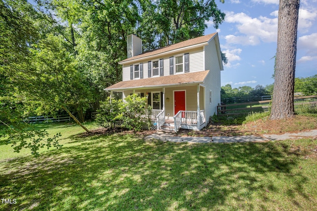 40 Crepe Myrtle Ct, Angier, NC 27501 - view of front of home with a chimney and a porch