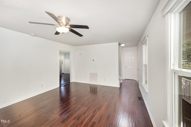 40 Crepe Myrtle Ct, Angier, NC 27501 - empty room with dark wood-style flooring, a ceiling fan, baseboards, and a smoke detector