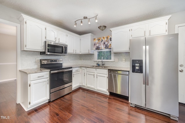 40 Crepe Myrtle Ct, Angier, NC 27501 - kitchen featuring appliances with stainless steel finishes, a sink, and white cabinets