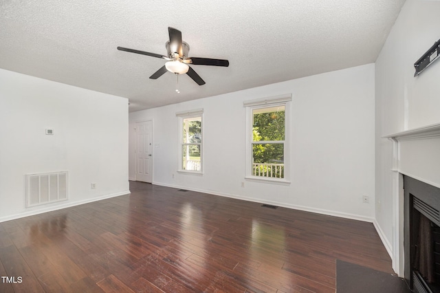 40 Crepe Myrtle Ct, Angier, NC 27501 - unfurnished living room with ceiling fan, hardwood / wood-style flooring, a fireplace with flush hearth, a textured ceiling, and baseboards