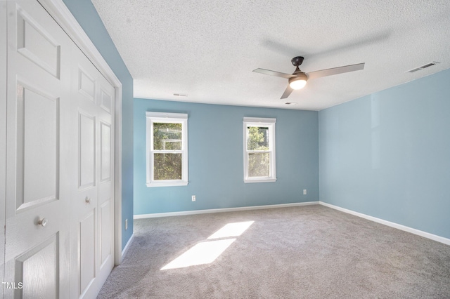 40 Crepe Myrtle Ct, Angier, NC 27501 - unfurnished bedroom featuring a textured ceiling, carpet floors, baseboards, and a ceiling fan