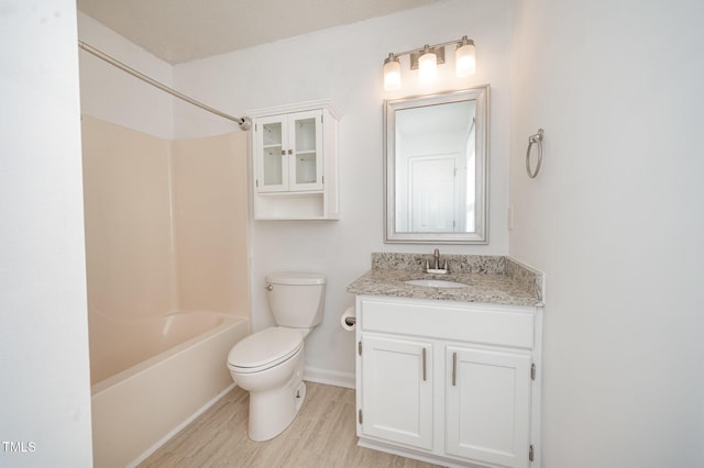 40 Crepe Myrtle Ct, Angier, NC 27501 - full bathroom featuring wood finished floors, toilet, vanity, tub / shower combination, and baseboards