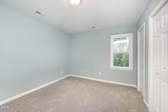 40 Crepe Myrtle Ct, Angier, NC 27501 - unfurnished bedroom with a textured ceiling, carpet, and baseboards