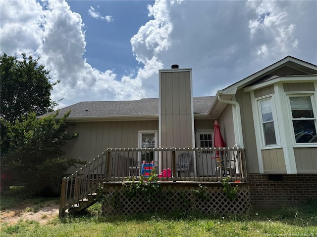 6651 Brookshire St, Fayetteville, NC 28314 - rear view of house featuring a chimney, a wooden deck, roof with shingles, and stairs
