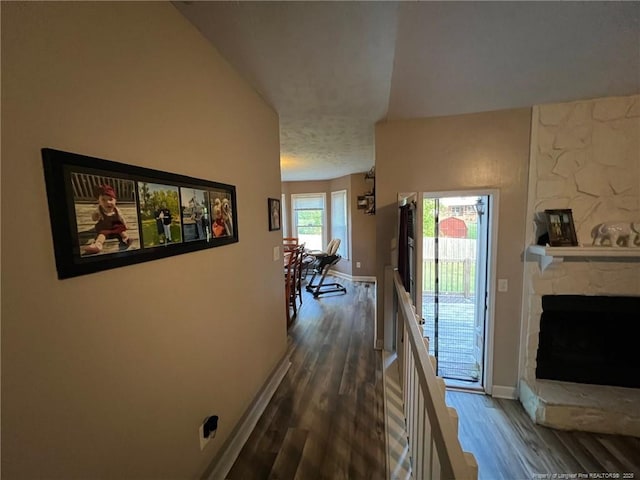 6651 Brookshire St, Fayetteville, NC 28314 - hallway featuring dark wood finished floors, an upstairs landing, baseboards, and a textured ceiling