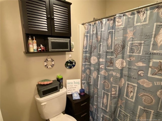 6651 Brookshire St, Fayetteville, NC 28314 - bathroom featuring toilet and a shower with shower curtain