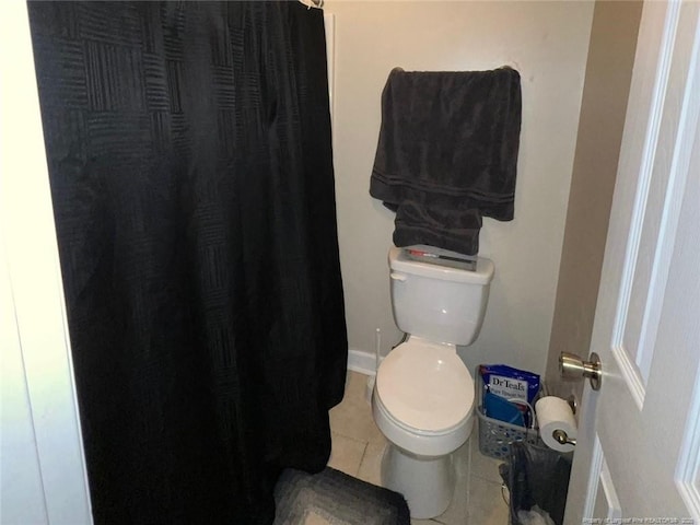 6651 Brookshire St, Fayetteville, NC 28314 - full bath with tile patterned flooring, toilet, and a shower with curtain